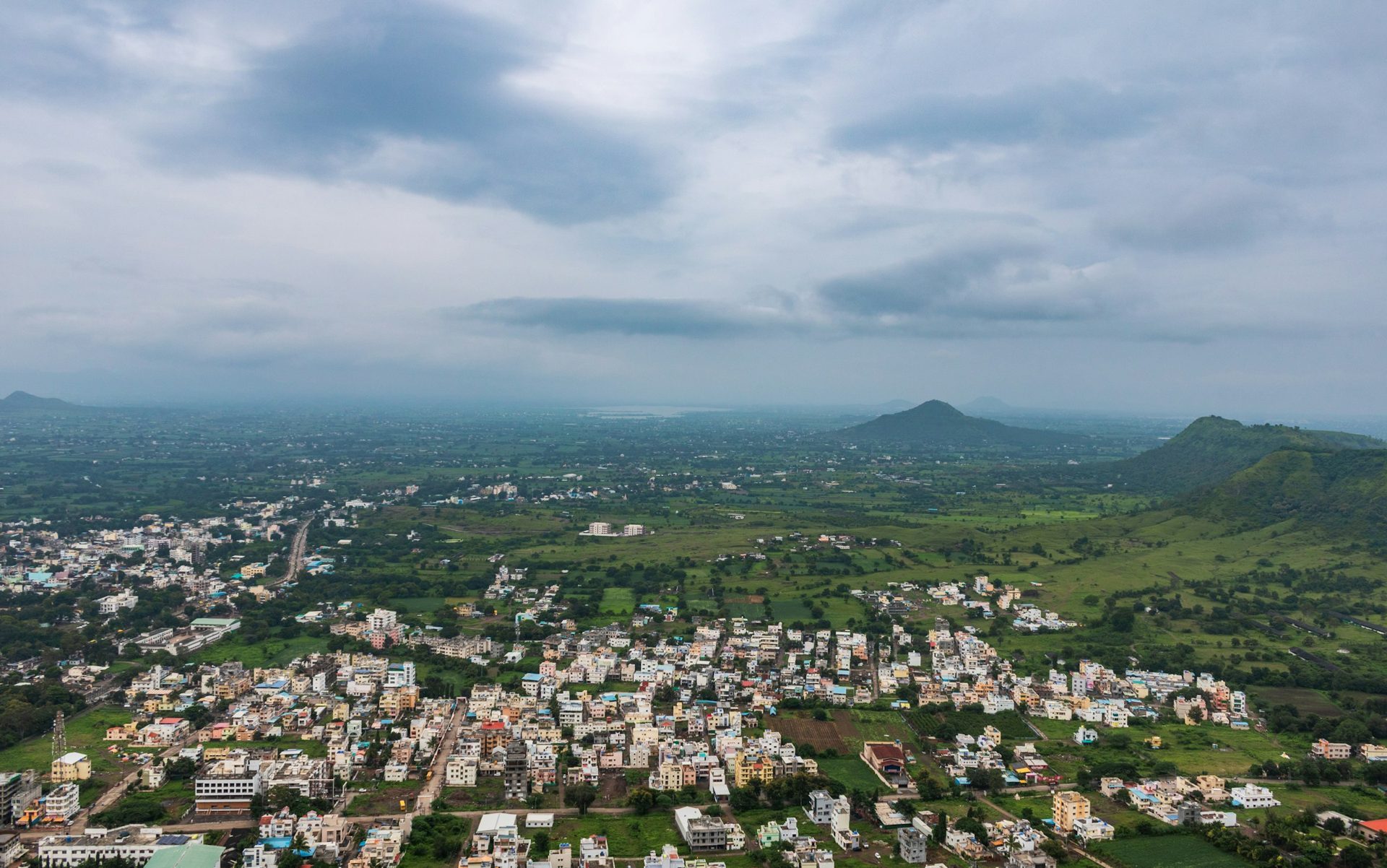 A town nestled in green hills